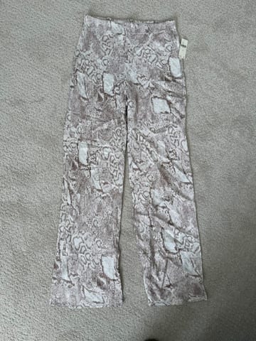 White pants with tan snake pattern